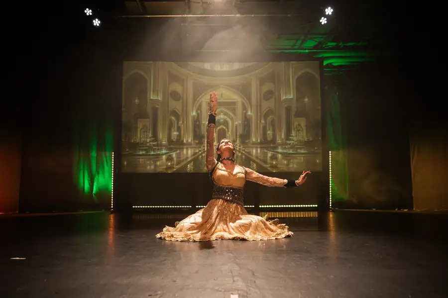 Dancer in a gold lehenga performing a semi-classical piece